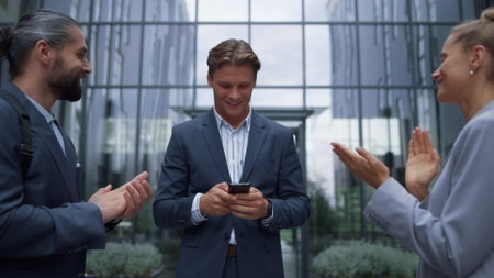 Businessman announce happy news to employees. Smiling stuff applauding leader. Confident satisfied...