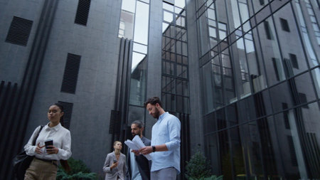 Serious businessman holding papers read details at downtown. Thoughtful manager analyzing statistics outdoors morning. Tensed bearded man financial director check contract pages. Corporate lifestyle.の写真素材