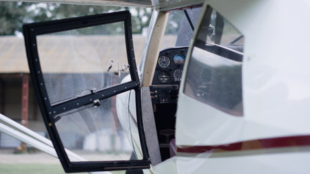 Ultralight plane parked airfield waiting pilot ready to flight close up. Small white lightweight...