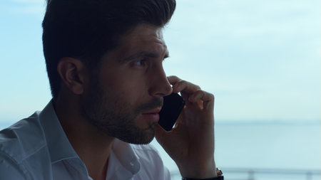 Focused entrepreneur having unpleasant phone conversation profile. Upset man discussing business...