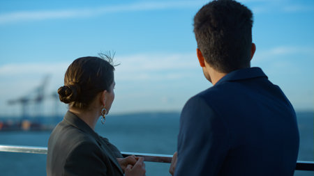 Business team discussing deal looking sea closeup. Two partners relax on balcony talking commercial...