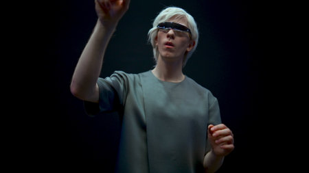 Fashionable man using vr glasses closeup. Focused millennial scrolling playing augmented reality...