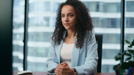 Confident woman working modern office sitting at desk with computer close up. Portrait of focused...
