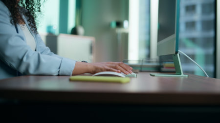 Closeup businesswoman arms typing keyboard in office. Unknown ceo pressing modern computer buttons macro view. Unrecognizable woman using digital device at remote workplace alone. Business conceptの写真素材