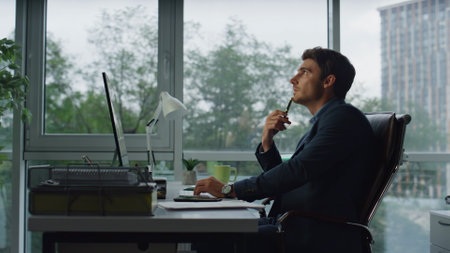 Office employee searching ideas considering business problems at workplace. Inspired businessman...