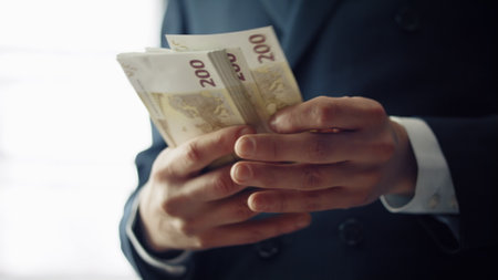 Man hands counting cash european currency indoors close up. Unknown elegant businessman calculating...