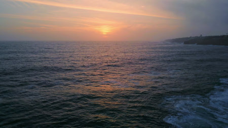 Beautiful sea at evening twilight cloudy summer weather. Picturesque powerful ocean rippling under...