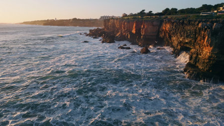 Evening seascape rocky seacoast with foaming waving ocean water aerial view. Beautiful deep dark sea...