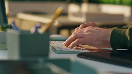 Freelancer hands texting keyboard at home office close up. Unrecognizable man startuper working computer creating business email at sunny room. Developer fingers pressing buttons writing code at workの写真素材