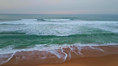 Gloomy ocean surf horizon close up. Serene sea coast with foaming grey waves. Picturesque deep marine landscape slow motion. Swell rolling empty seashore. Dusk water surface in dramatic skyline cloudsの写真素材