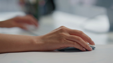 Developer hands coding keyboard at light interior close up. Unknown woman working computer at office alone. Unrecognizable programmer using pc digital device at remote workplace. Freelance conceptの写真素材