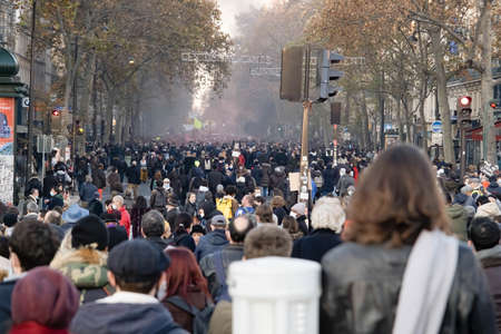 Paris, France - November 28th 2020: at the march against the global security law, a huge crowd walking in the streetのeditorial素材