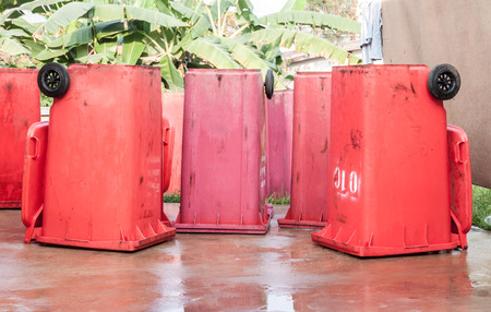 Large red trash can (garbage bin) with wheel
の写真素材
