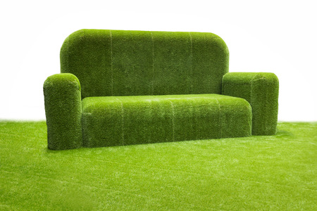 Grassy sofa on green grassの写真素材