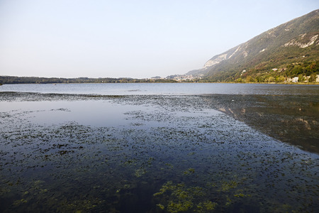 italian lake with mountain backgroundの写真素材