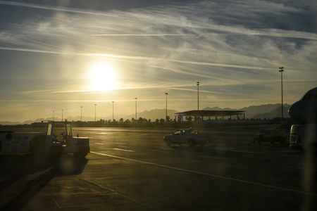 sunset over the runway at the airportの写真素材