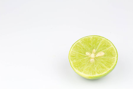 Half of lime on isolated white backgroundの写真素材