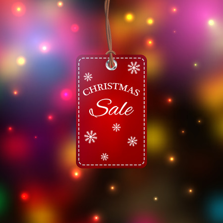 Christmas sales tag. Label  on a colorful blurred background. EPS10のイラスト素材