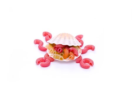 card colored macaroni and seashell isolated on whiteの写真素材