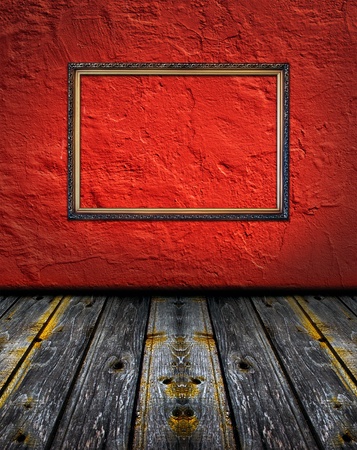 vintage red terracotta interior with empty classic frame hanging on the wall concept dissonanceの写真素材