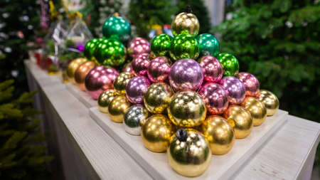 Christmas balls on the stand. Close-up of Christmas toys in a storeの写真素材