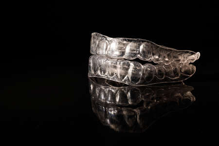 Removable plastic retainers on black background