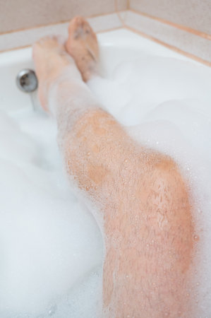 Funny Picture of a Man Taking a Relaxing Bath. Close-up of Male