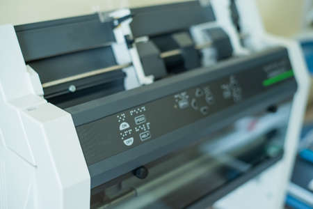 Close-up of equipment to print text on braille code for reading the blind