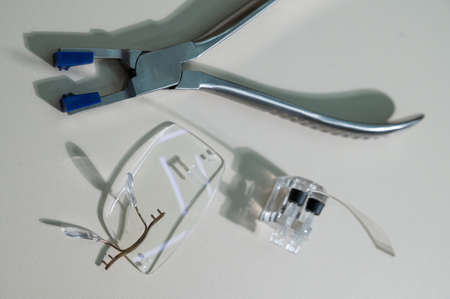 Disassembled glasses and instruments by an ophthalmologist.の写真素材