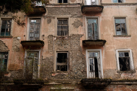 View of the facade of an abandoned ruined house in abkhazia.の写真素材
