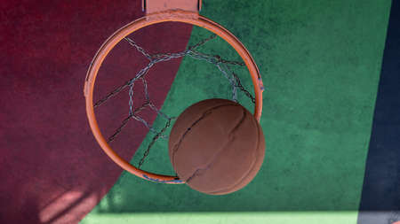 Top view of basketball basket with ball.