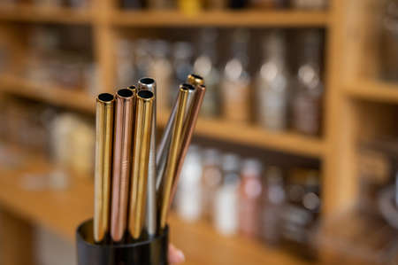 Close-up of reusable steel tubes at an eco storeの写真素材