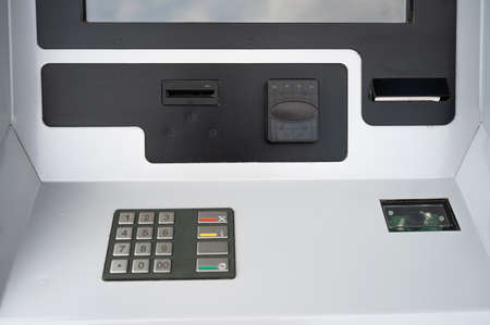 Close-up of a ticket vending machine with a blank black screen