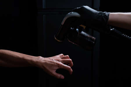 The master applies tinting paint to the womans hand. Instant tanning procedureの写真素材