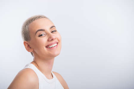 Young caucasian woman with short hair on a white background.の写真素材