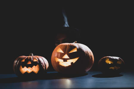 Portrait of a woman in a carnival halloween costume in the dark