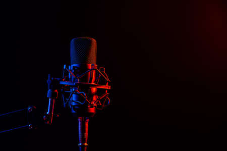 Professional microphone in pink smoke on a black background.の写真素材