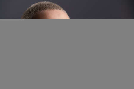 Portrait of pensive young woman with short hair on white background. Copy spaceの写真素材