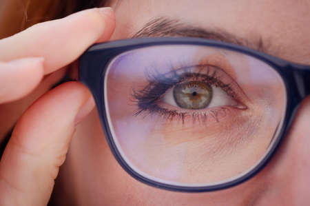 Close-up of a womans eye with glasses.の写真素材