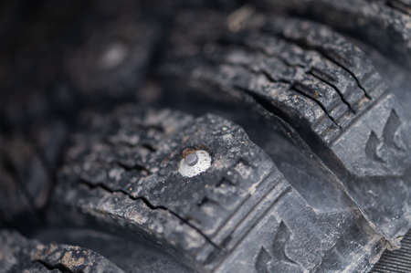 Close-up of winter studded wheels. Macro.の写真素材