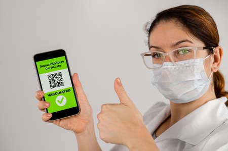 The doctor recommends vaccination and holds a smartphone with a QR code.