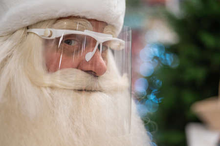 Portrait of russian santa claus in a protective visor.