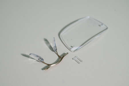 Broken frame of glasses on white background.の写真素材