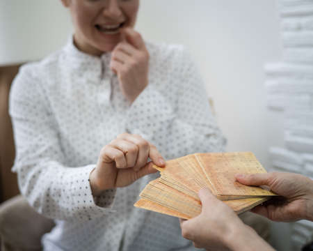 Psychologist uses metaphorical associative cards in a session with a patient.の写真素材