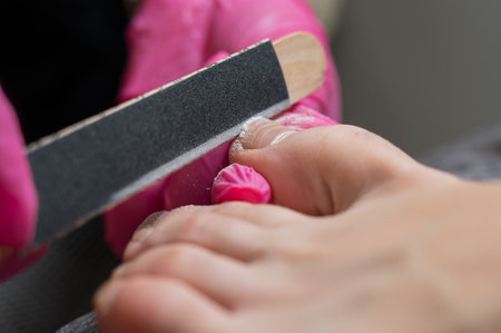 The master makes hardware pedicures to the client.の写真素材