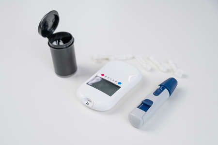 Home blood glucose test kit. Glucometer, lancet pen, needles and text strips.