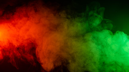 Red green smoke on a black background.の写真素材