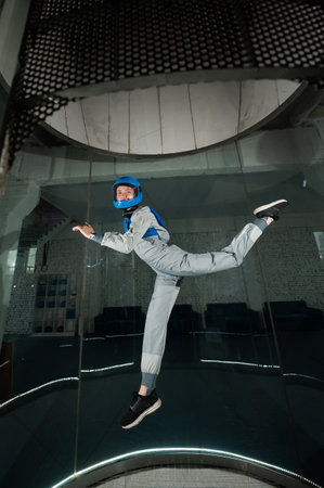 A woman flies in a wind tunnel. Free fall simulator.