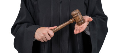 Faceless female judge in a robe holding a court gavel.の写真素材