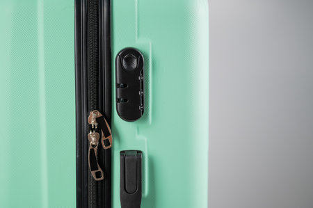 Close-up of a combination lock of a mint plastic suitcase.の写真素材